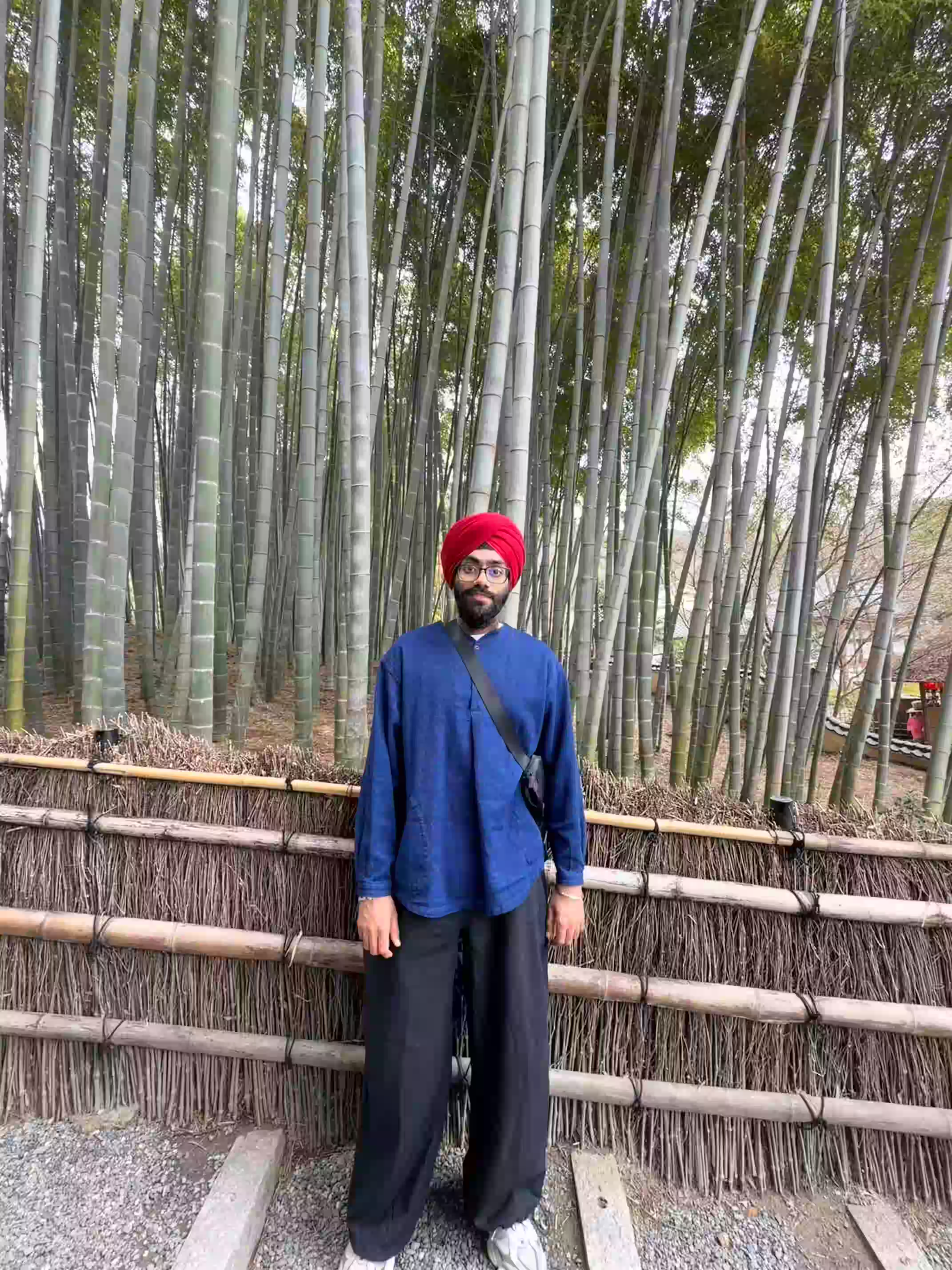 Ameek standing in front of a bamboo grove